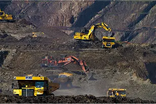a group of construction vehicles in a quarry